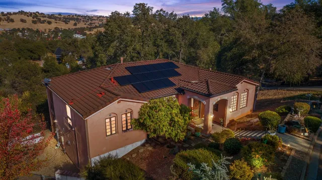 aerial view of a house with a yard