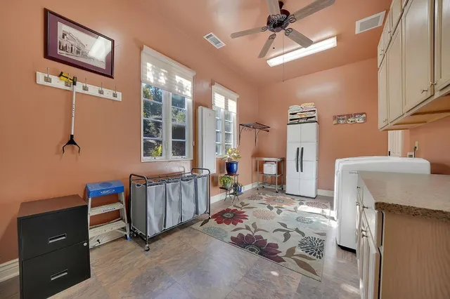a view of a yard with wooden fence