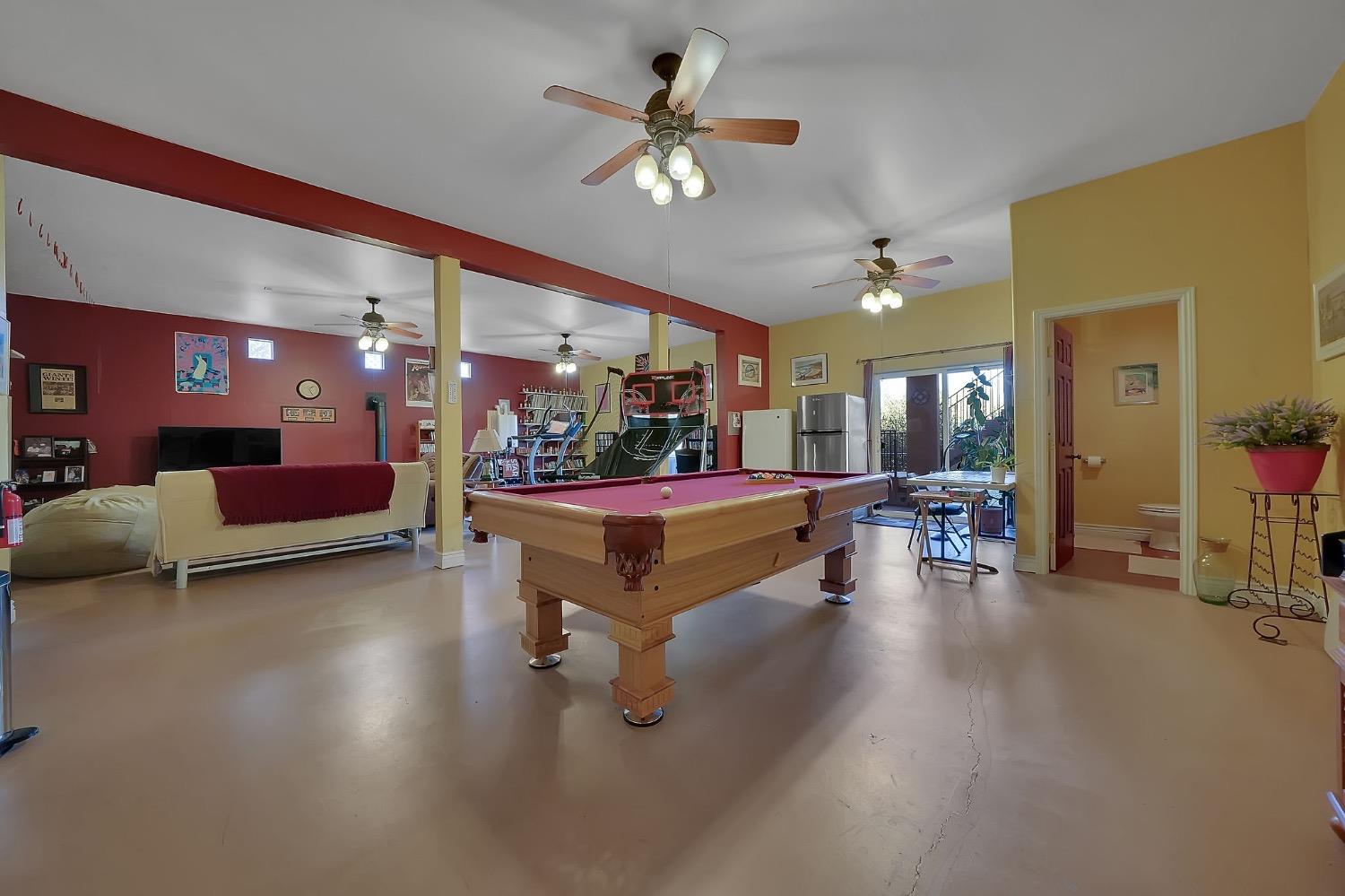 125 Raylan Drive Sutter Creek, CA 95685 - Photo 46 of 79 a living room with furniture and a chandelier