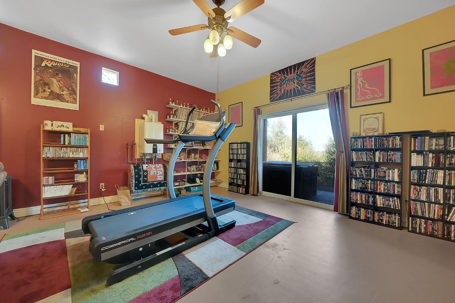 125 Raylan Drive Sutter Creek, CA 95685 - Photo 51 of 79 a living room with furniture pool table and wall paintings