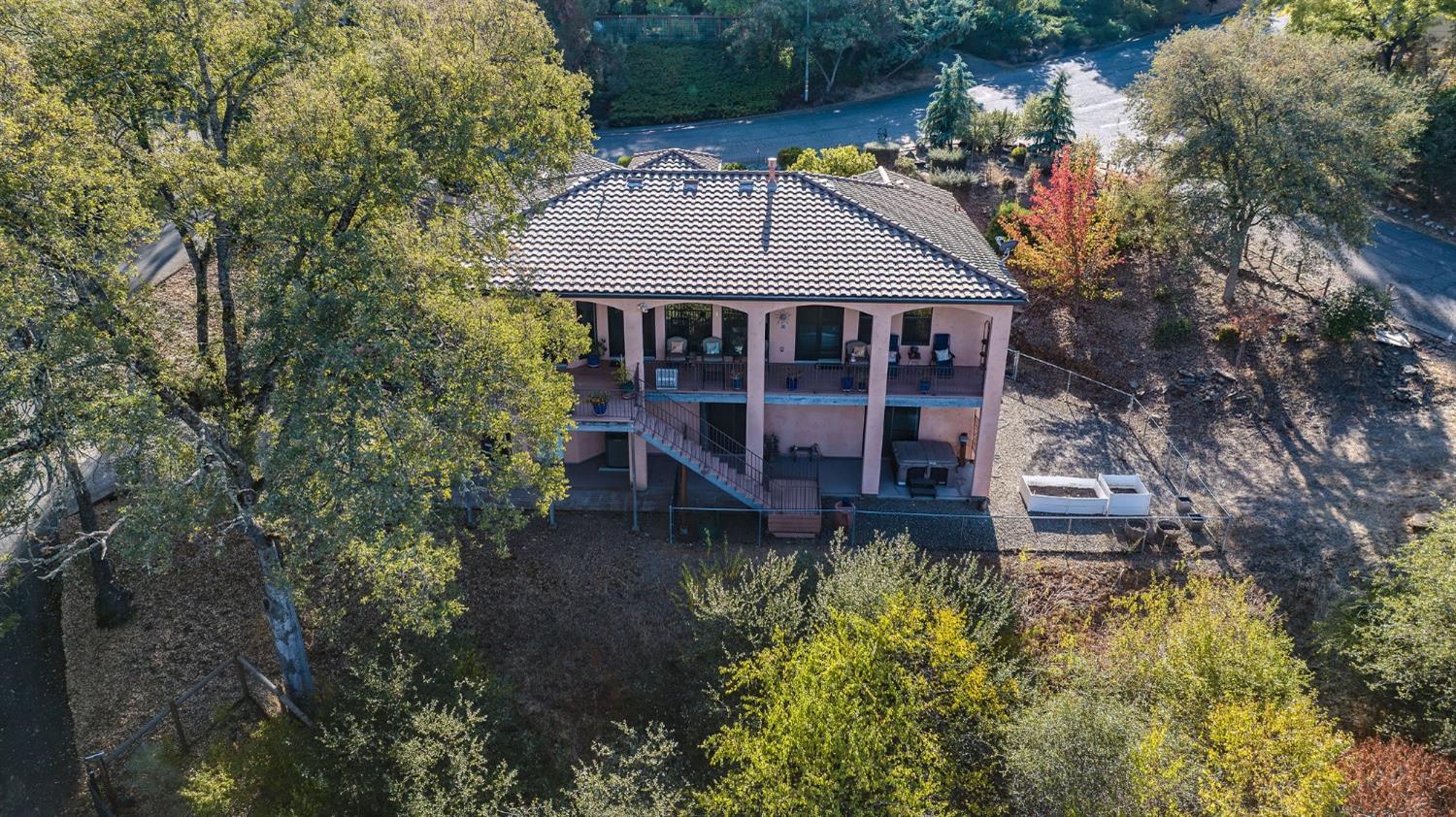 125 Raylan Drive Sutter Creek, CA 95685 - Photo 79 of 79 a view of a house with a small yard plants and large tree