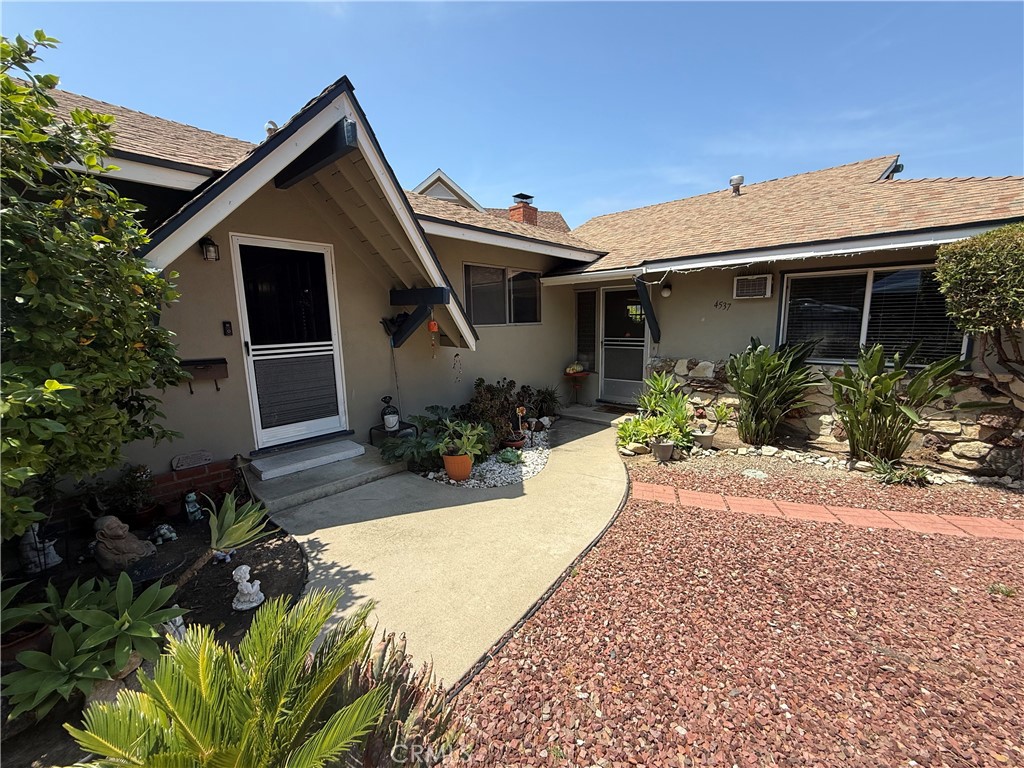 a front view of house with yard outdoor seating