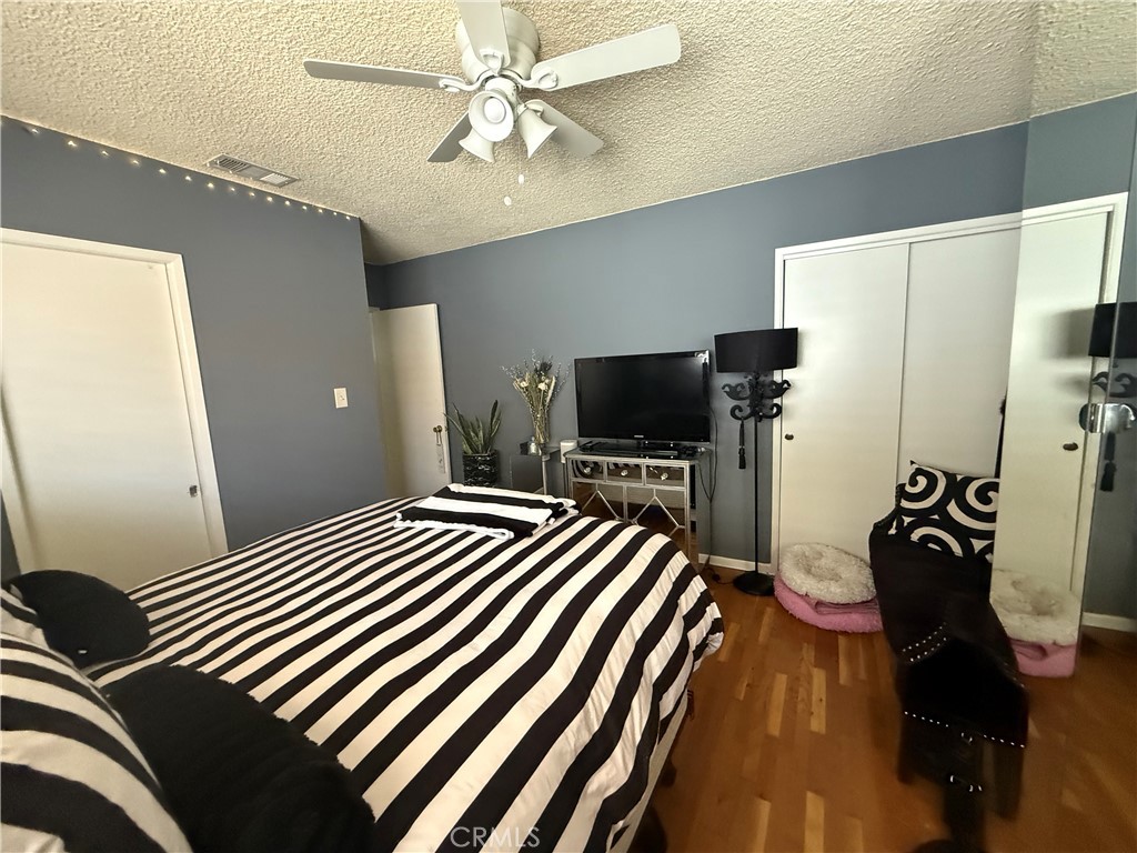 4535 Ramsdell Avenue La Crescenta, CA 91214 - Photo 13 of 28 a bedroom with a bed and a flat screen tv