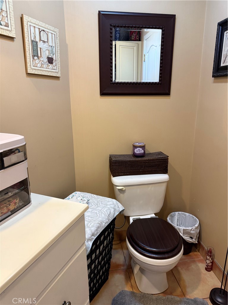 4535 Ramsdell Avenue La Crescenta, CA 91214 - Photo 18 of 28 a bathroom with a toilet a sink and mirror