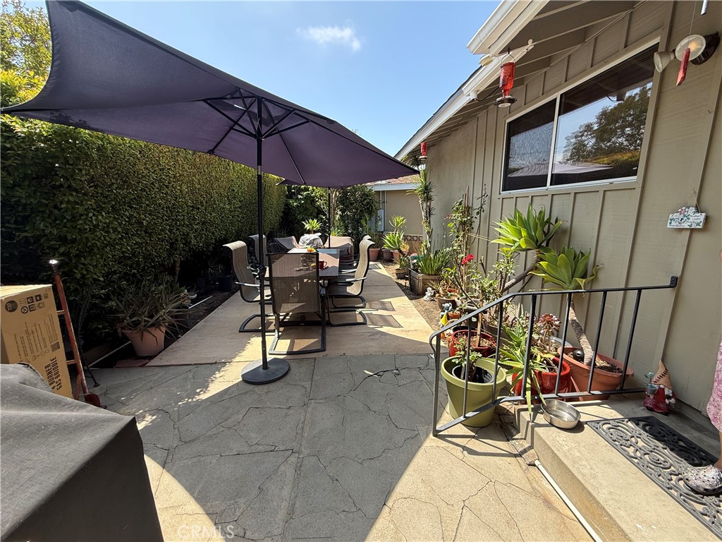 4535 Ramsdell Avenue La Crescenta, CA 91214 - Photo 3 of 28 a view of the patio with a dining table and chairs under an umbrella
