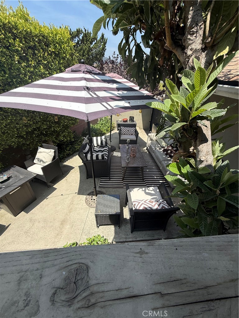 4535 Ramsdell Avenue La Crescenta, CA 91214 - Photo 4 of 28 a view of a patio with table and chairs potted plants with wooden floor