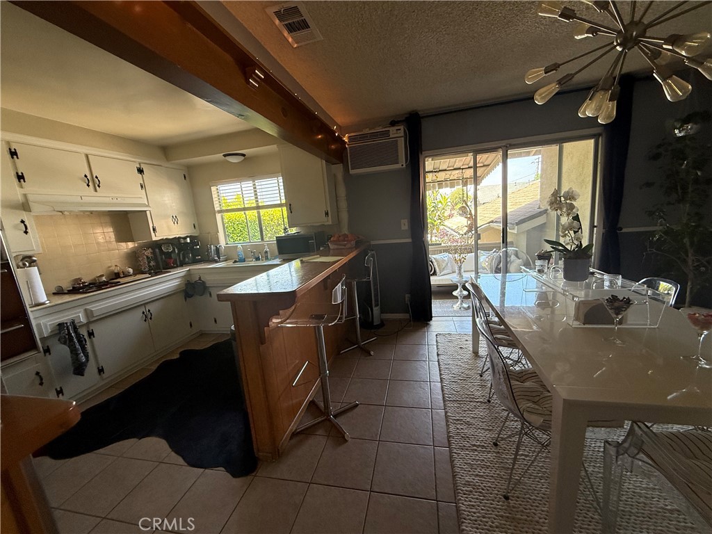 4535 Ramsdell Avenue La Crescenta, CA 91214 - Photo 6 of 28 a kitchen with a sink a counter top space and stainless steel appliances