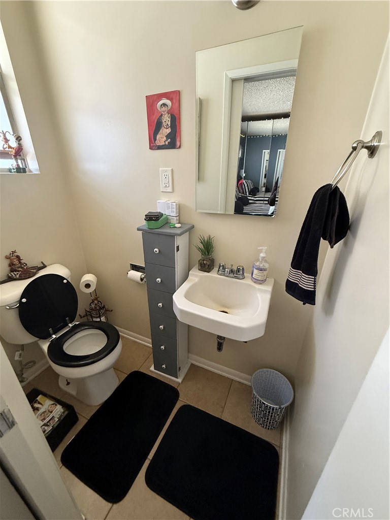 4535 Ramsdell Avenue La Crescenta, CA 91214 - Photo 10 of 28 a bathroom with a toilet a sink and a mirror