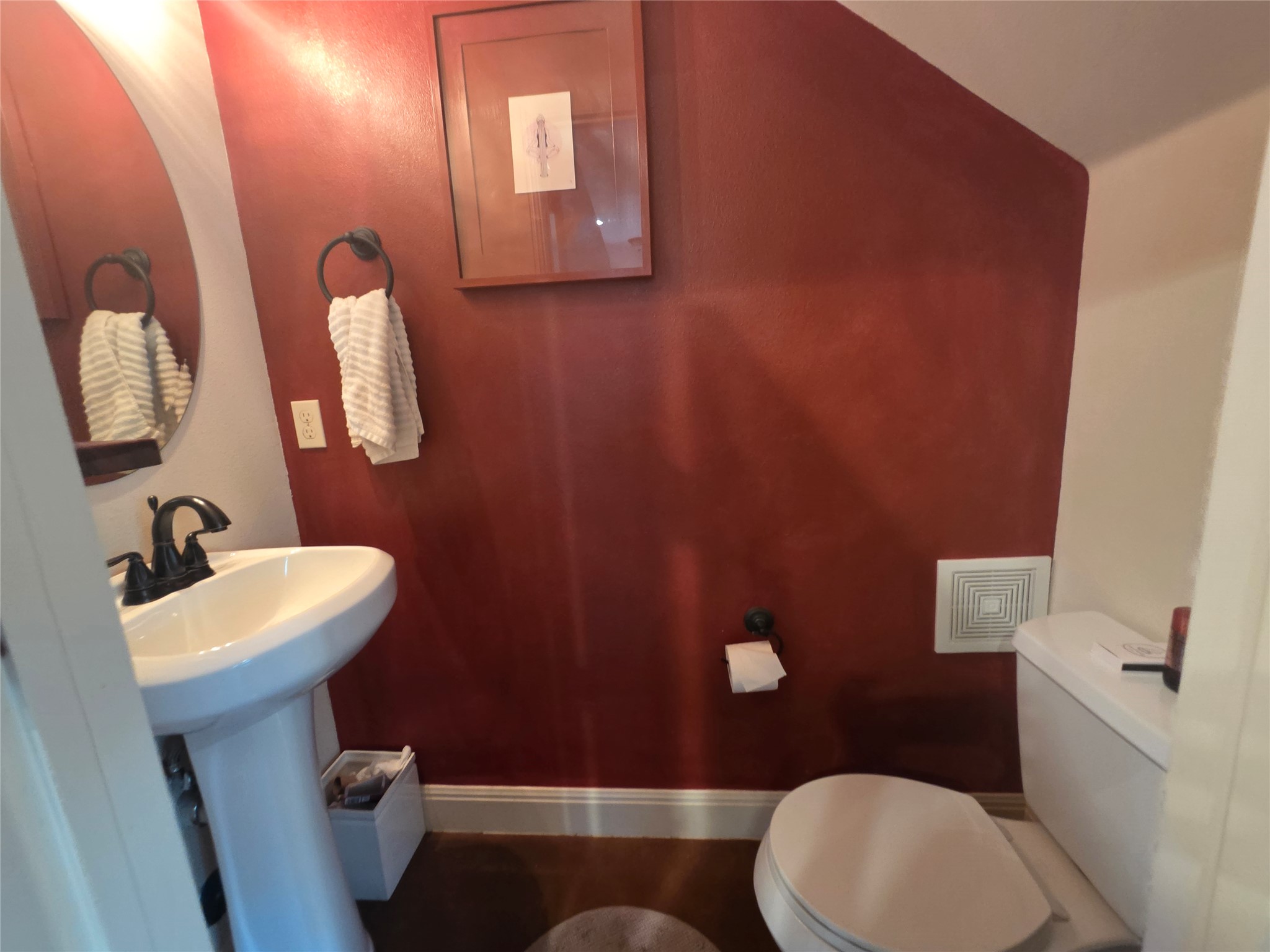 408 West Croslin Street Austin, TX 78752 - Photo 15 of 29 A compact and functional bathroom offering a pedestal sink and essential fixtures.
