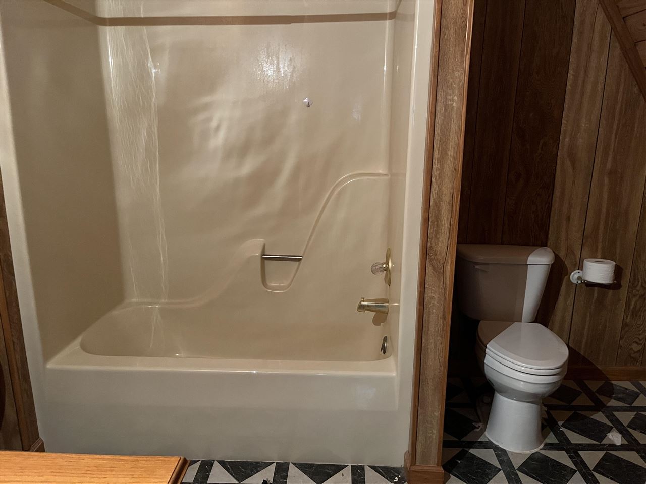 110 Edgewater Drive Middleton, TN 38052 - Photo 16 of 16 a white bath tub sitting next to a toilet