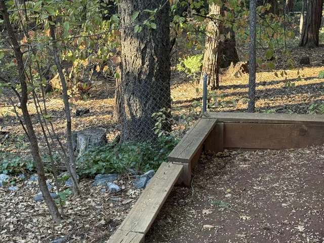 a view of a back yard from a balcony