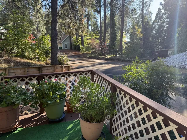 a view of a chair and table in the patio