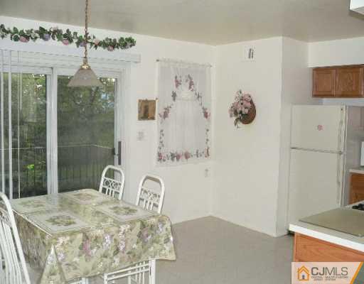 37 Judson Street, Unit 8A Edison, NJ 08837 - Photo 6 of 7 a bathroom with a granite countertop sink a mirror and shower