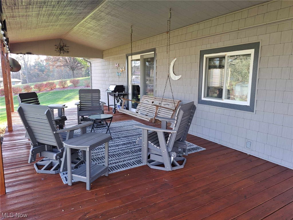 25910 Lashley Road Quaker City, OH 43773 - Photo 12 of 37 Covered Porch/Deck with Cathedral Ceiling