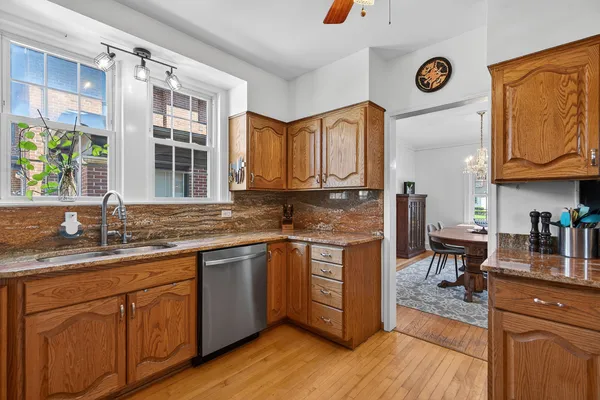 a kitchen with stainless steel appliances granite countertop counter space a sink and cabinets