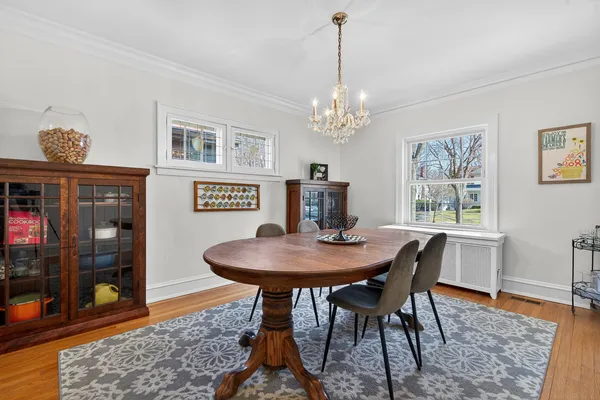 a view of a dining room with furniture window and wooden floor