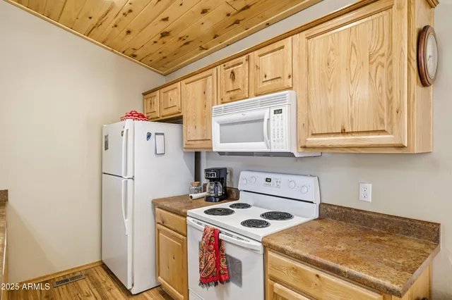 a kitchen with a sink and a stove top oven