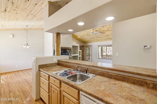 an empty room with fan and entrance