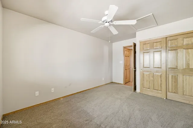 a bathroom with a sink a toilet and shower curtain