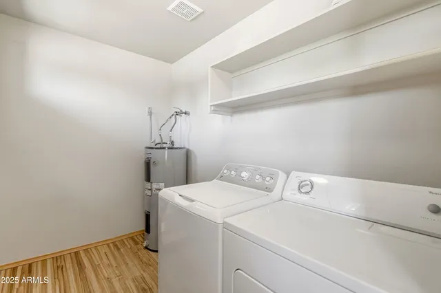 a porch with wooden floor in front of a house
