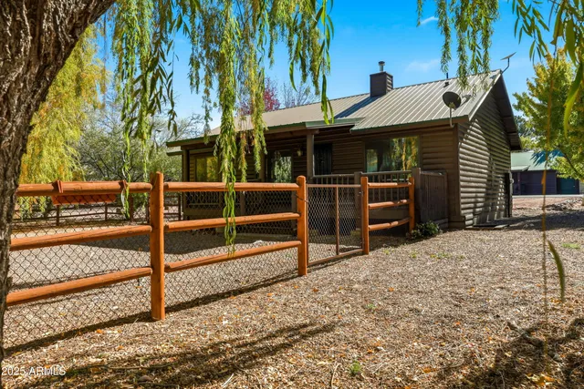 a view of park with wooden fence
