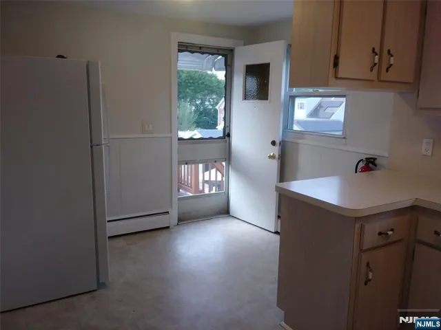 a view of kitchen and windows