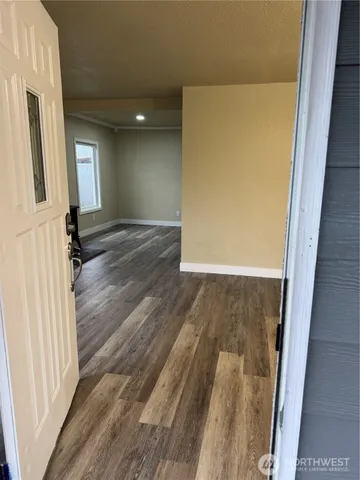 a view of front door with wooden floor