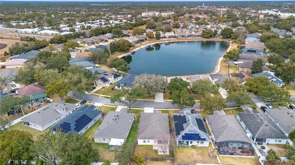 an aerial view of residential houses with outdoor space