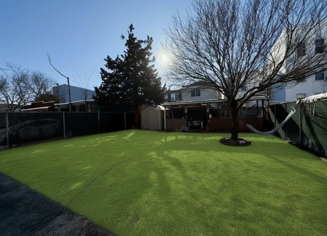 a house view with a sitting space and garden