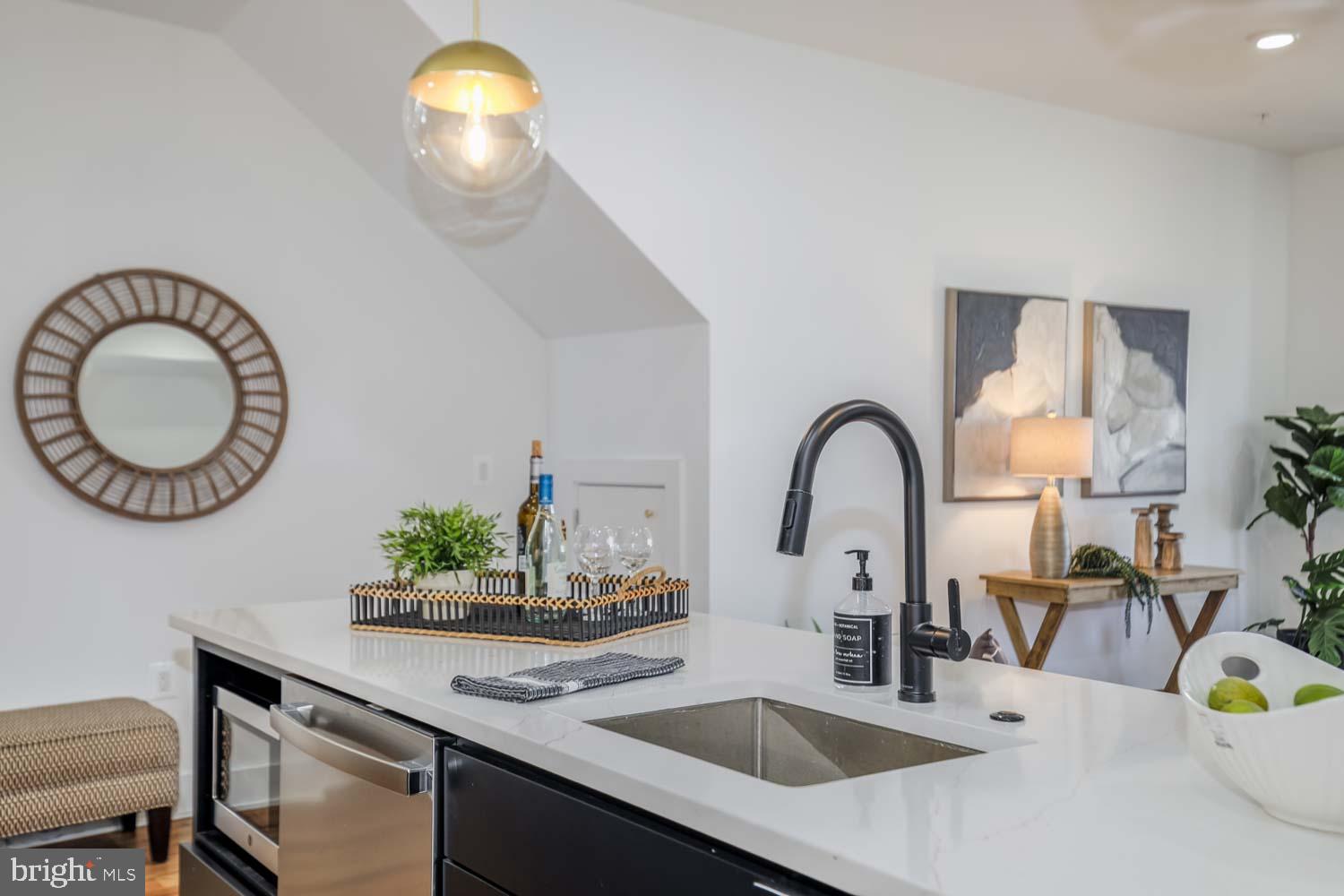 428 Manor Place Northwest, Unit 2 Washington, DC 20010 - Photo 11 of 27 a kitchen with a sink and a stove with wooden floor