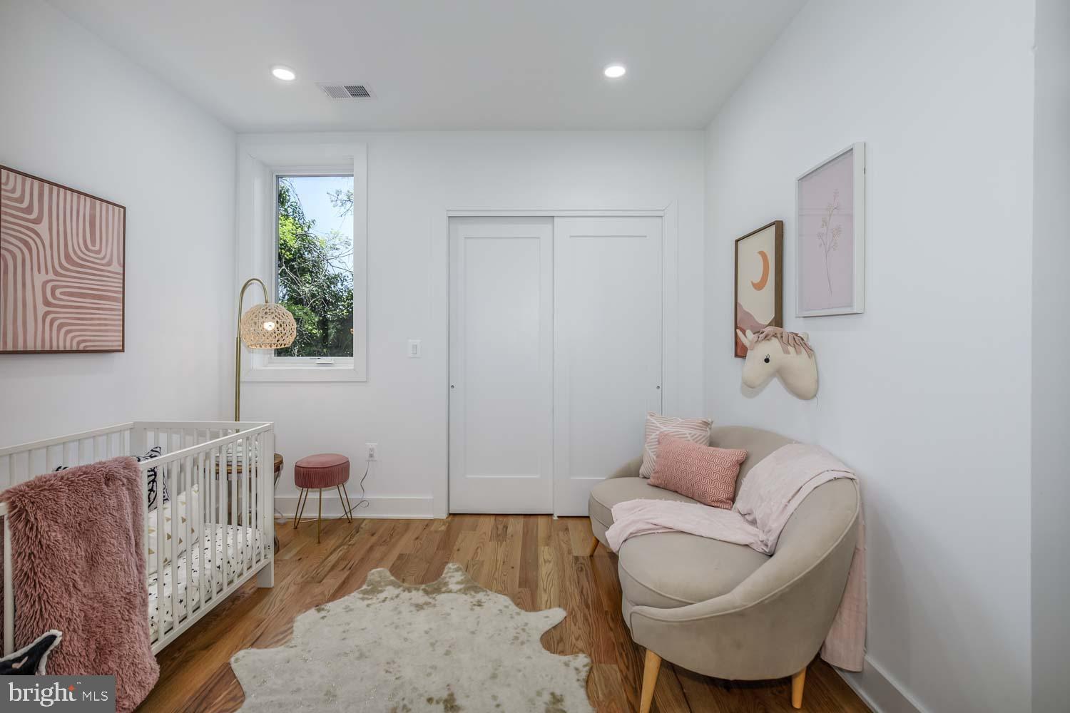 428 Manor Place Northwest, Unit 2 Washington, DC 20010 - Photo 13 of 27 a living room with furniture and a couch