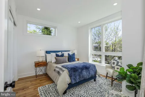 a bedroom with bed and a window