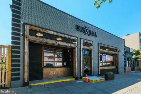 a view of a brick building with a large window