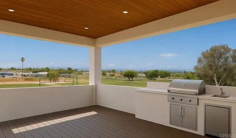 a view of a ocean with a floor to ceiling window and wooden floor