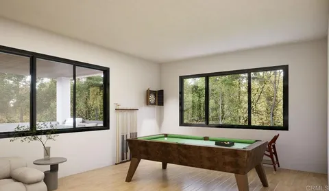 a room with a workspace and a window