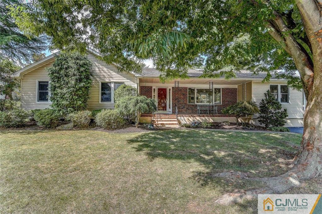 16 Mockingbird Road Edison, NJ 08820 - Photo 1 of 25 a front view of house with yard and green space