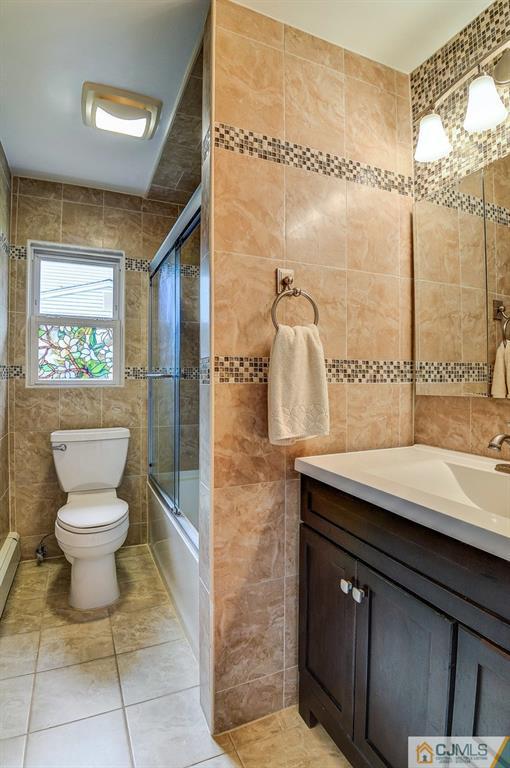 16 Mockingbird Road Edison, NJ 08820 - Photo 17 of 25 a bathroom with a sink toilet and shower