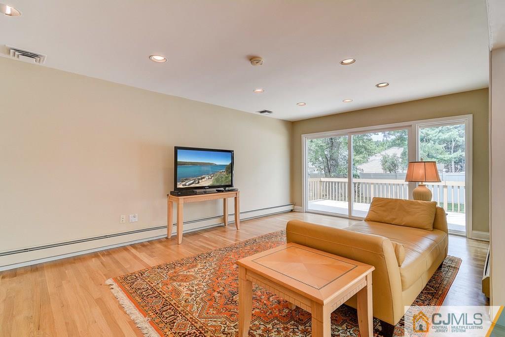 16 Mockingbird Road Edison, NJ 08820 - Photo 3 of 25 a living room with a bed furniture and next to a window