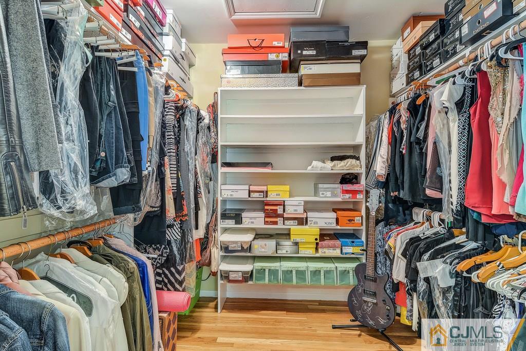 16 Mockingbird Road Edison, NJ 08820 - Photo 21 of 25 a view of walk in closet with clothes and shoes