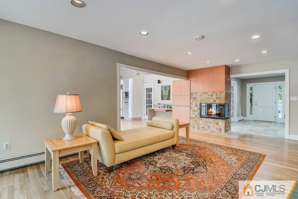 16 Mockingbird Road Edison, NJ 08820 - Photo 4 of 25 a living room with furniture and a wooden floor
