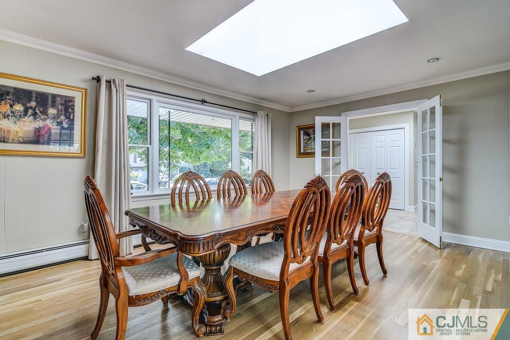 16 Mockingbird Road Edison, NJ 08820 - Photo 10 of 25 a view of a dining room with furniture window and wooden floor