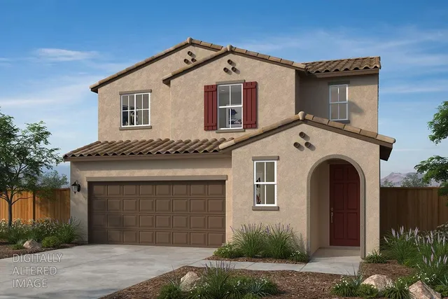 a front view of a house with a garden and garage
