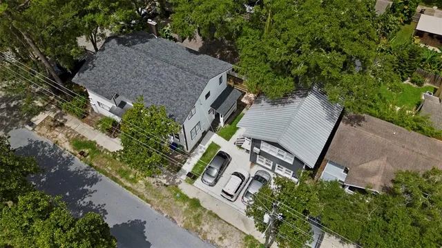 an aerial view of a house with outdoor space and street view