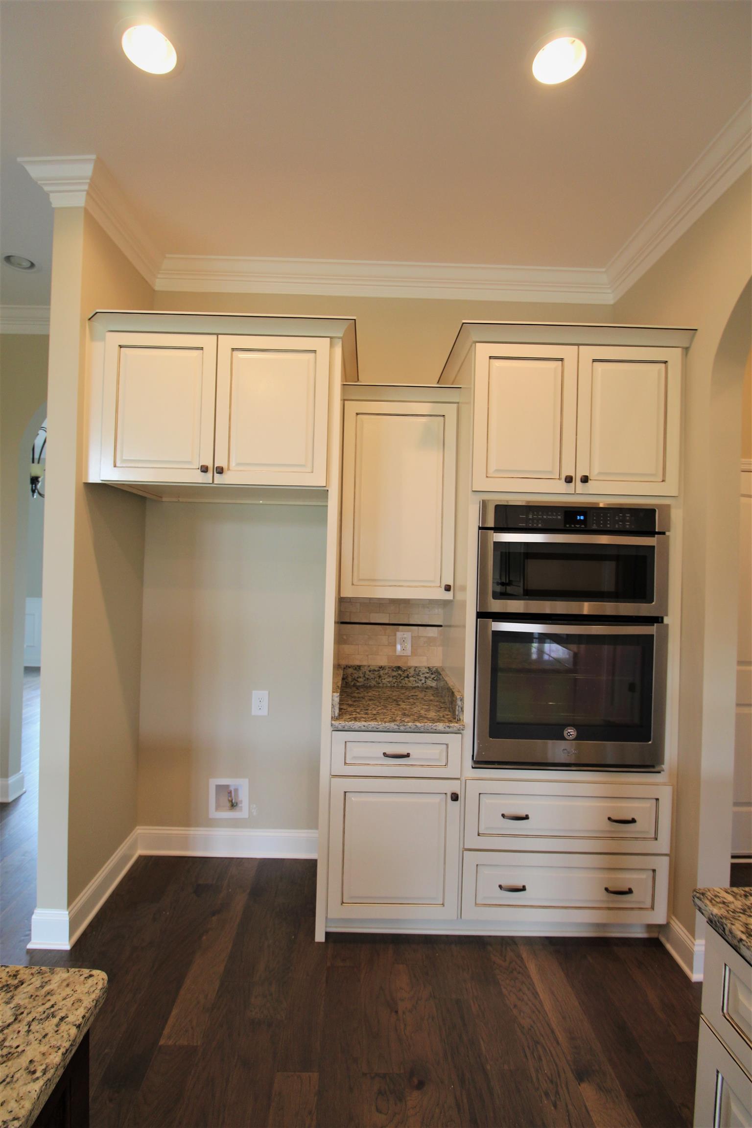 288 Bates Road Lebanon, TN 37087 - Photo 12 of 26 a kitchen with granite countertop white cabinets and stainless steel appliances