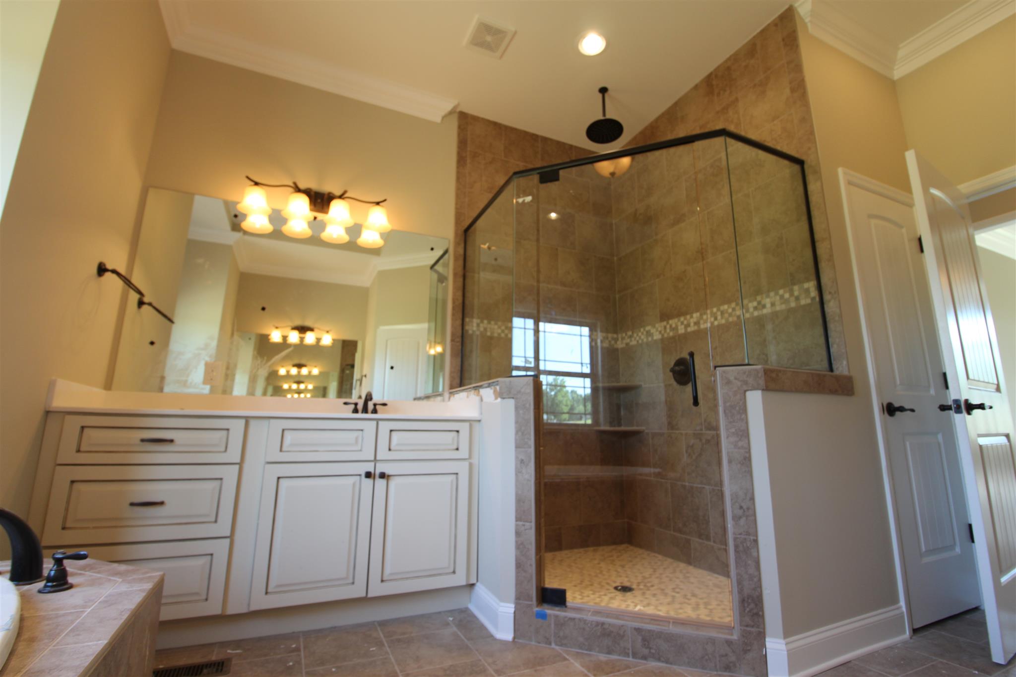 288 Bates Road Lebanon, TN 37087 - Photo 18 of 26 a bathroom with a shower sink and mirror