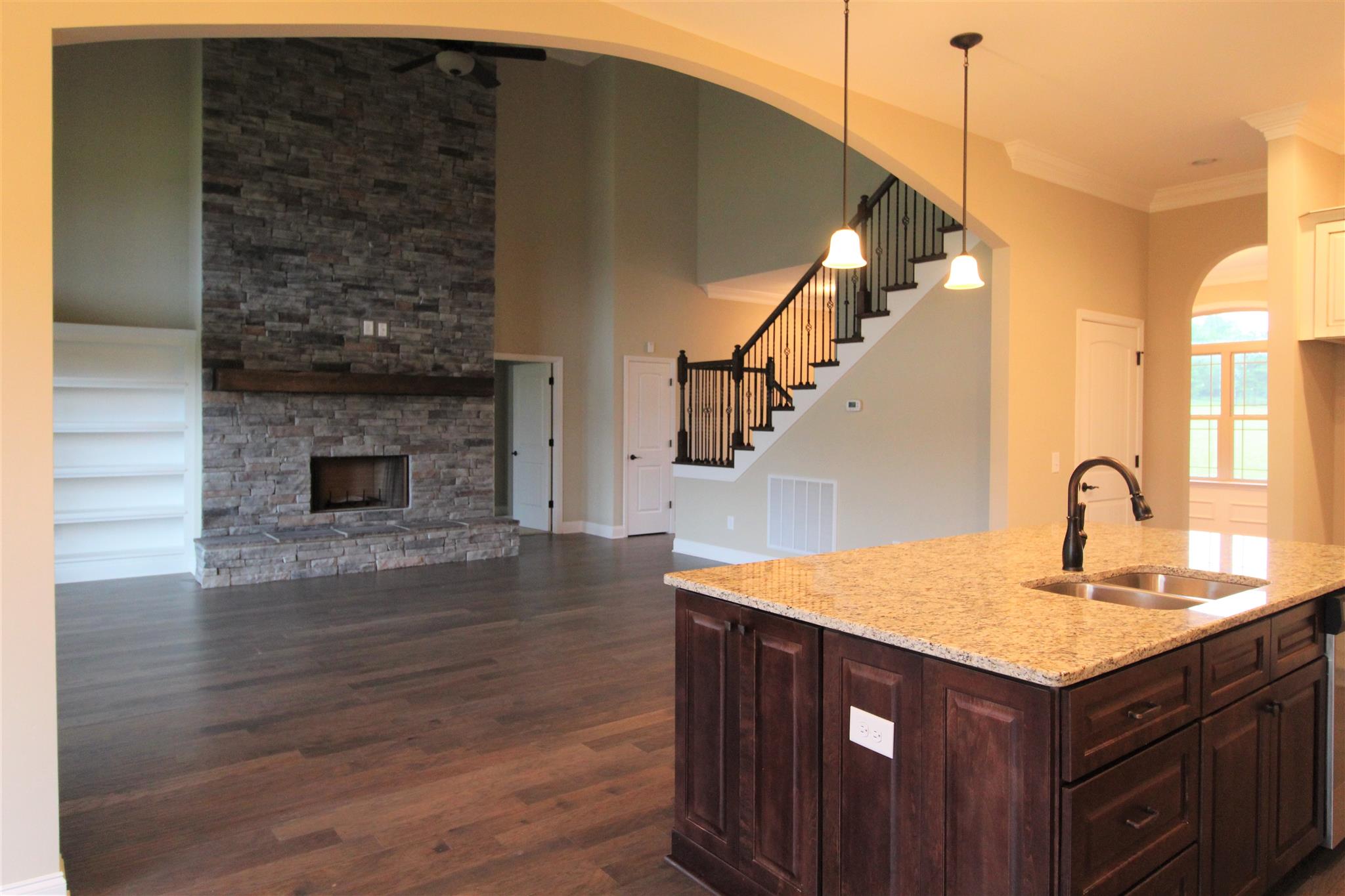 288 Bates Road Lebanon, TN 37087 - Photo 5 of 26 a kitchen with a sink a microwave oven and a fireplace