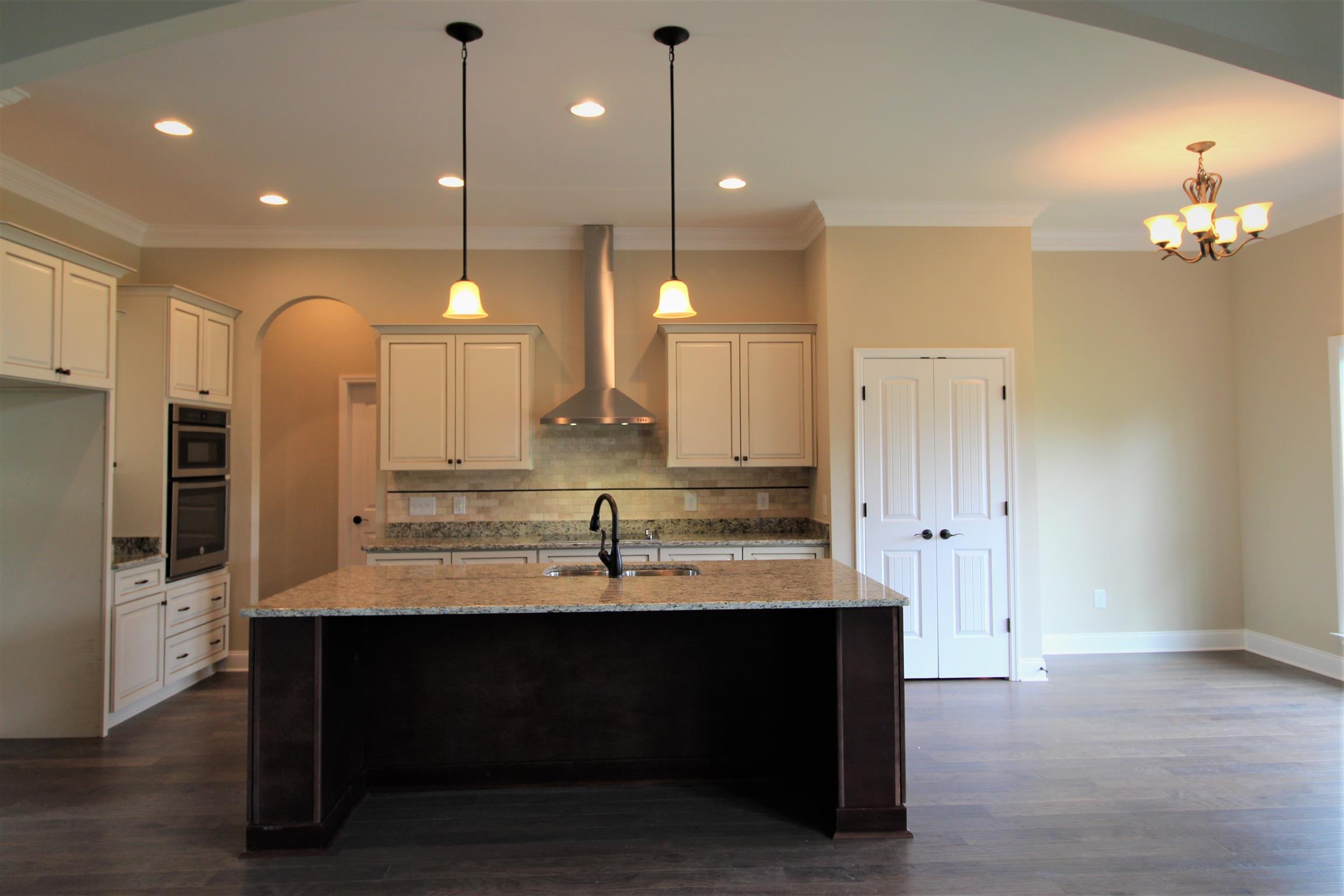 288 Bates Road Lebanon, TN 37087 - Photo 8 of 26 a kitchen with kitchen island a sink stainless steel appliances and cabinets