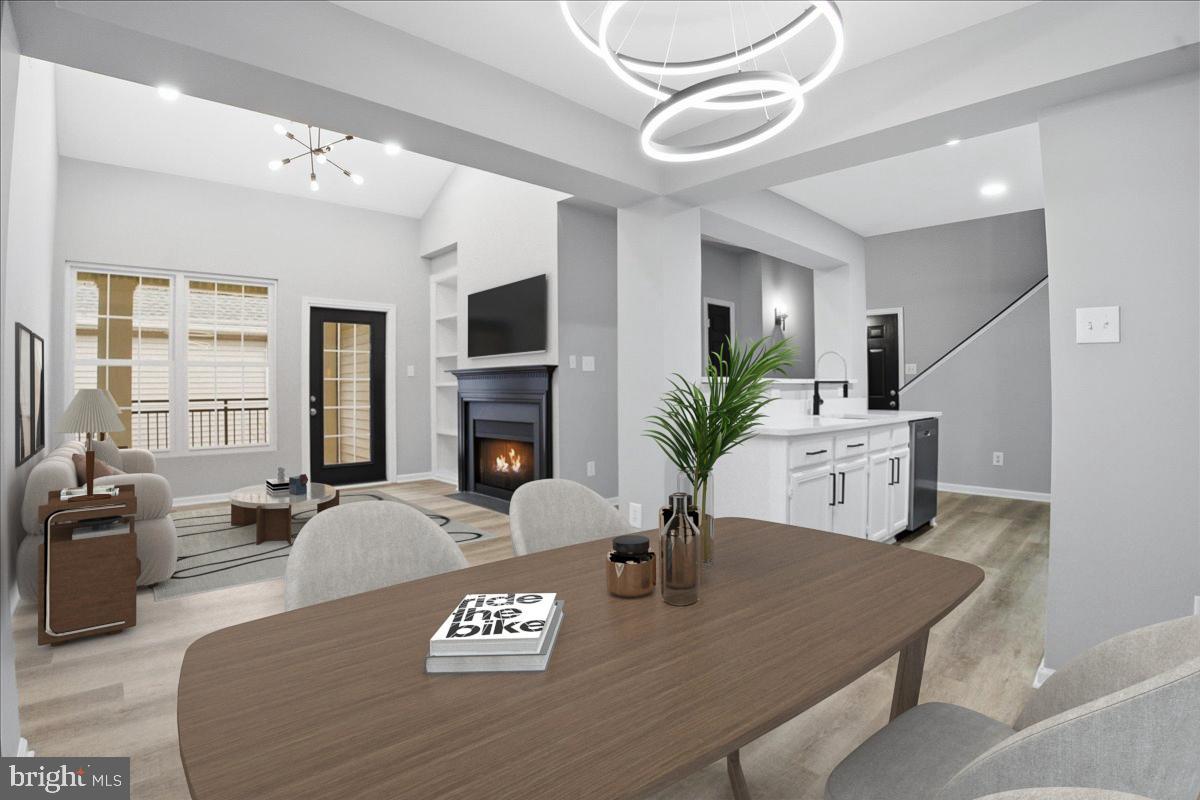 20419 Riverbend Square, Unit 301 Sterling, VA 20165 - Photo 4 of 25 a living room with furniture and a fireplace