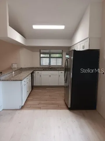 a view of a kitchen with a sink