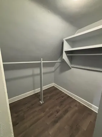 a view of an empty walk in closet